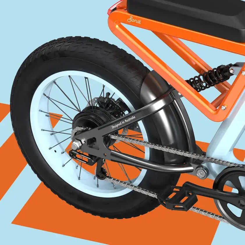 Electric bike with orange frame and black seat on a blue background