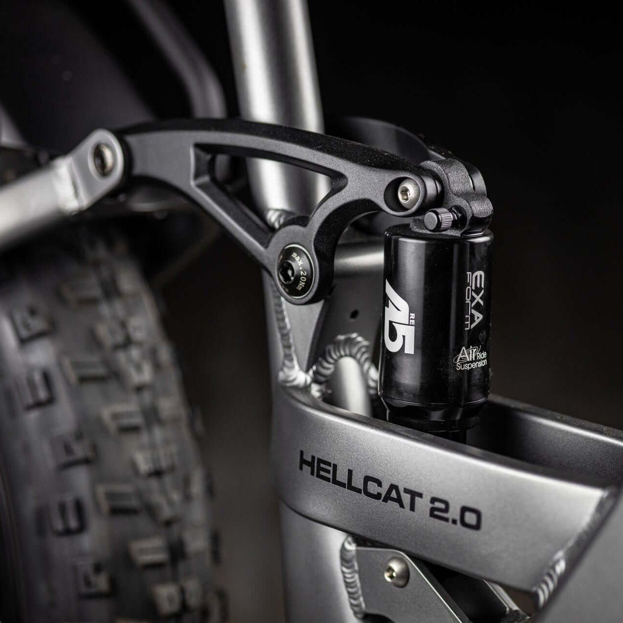 Close-up of a motorcycle suspension system with 'Hellcat 2.0' branding.