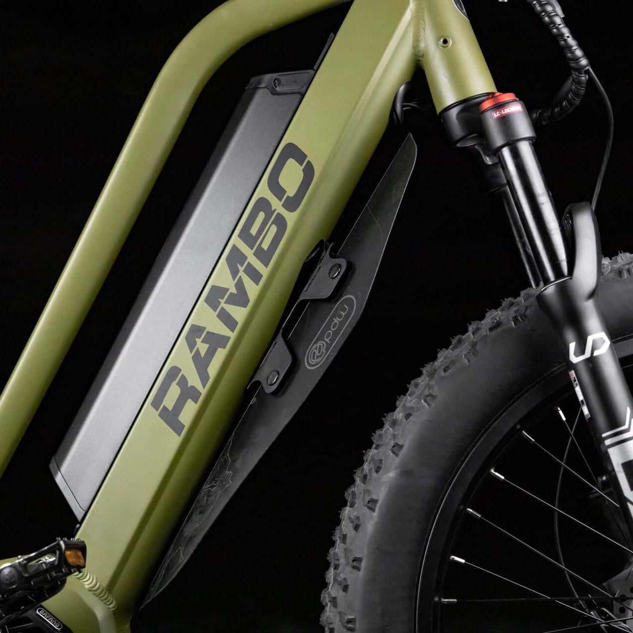 Close-up of a green electric bike with 'RAMBO' branding on a black background