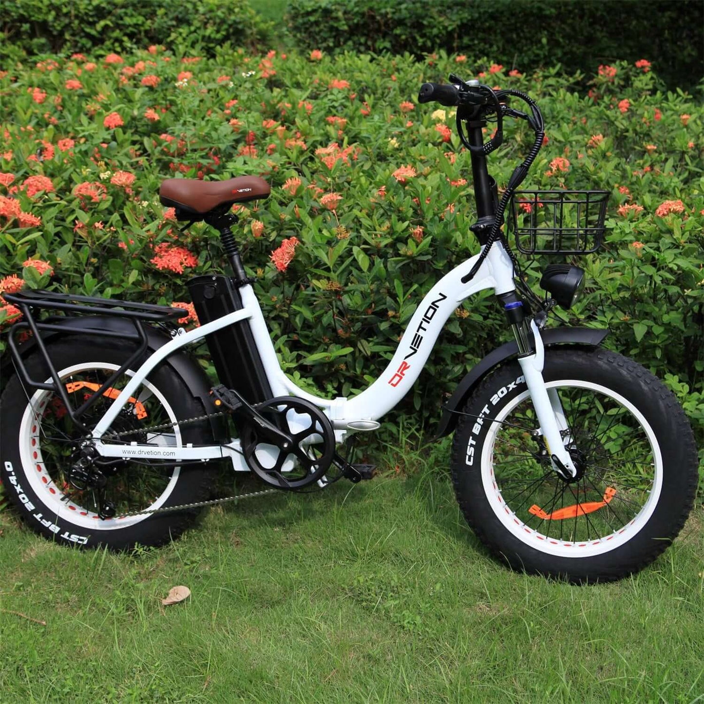 Drvetion CT20 Fat Tire Folding Electric Bike parked among flowers in a garden.