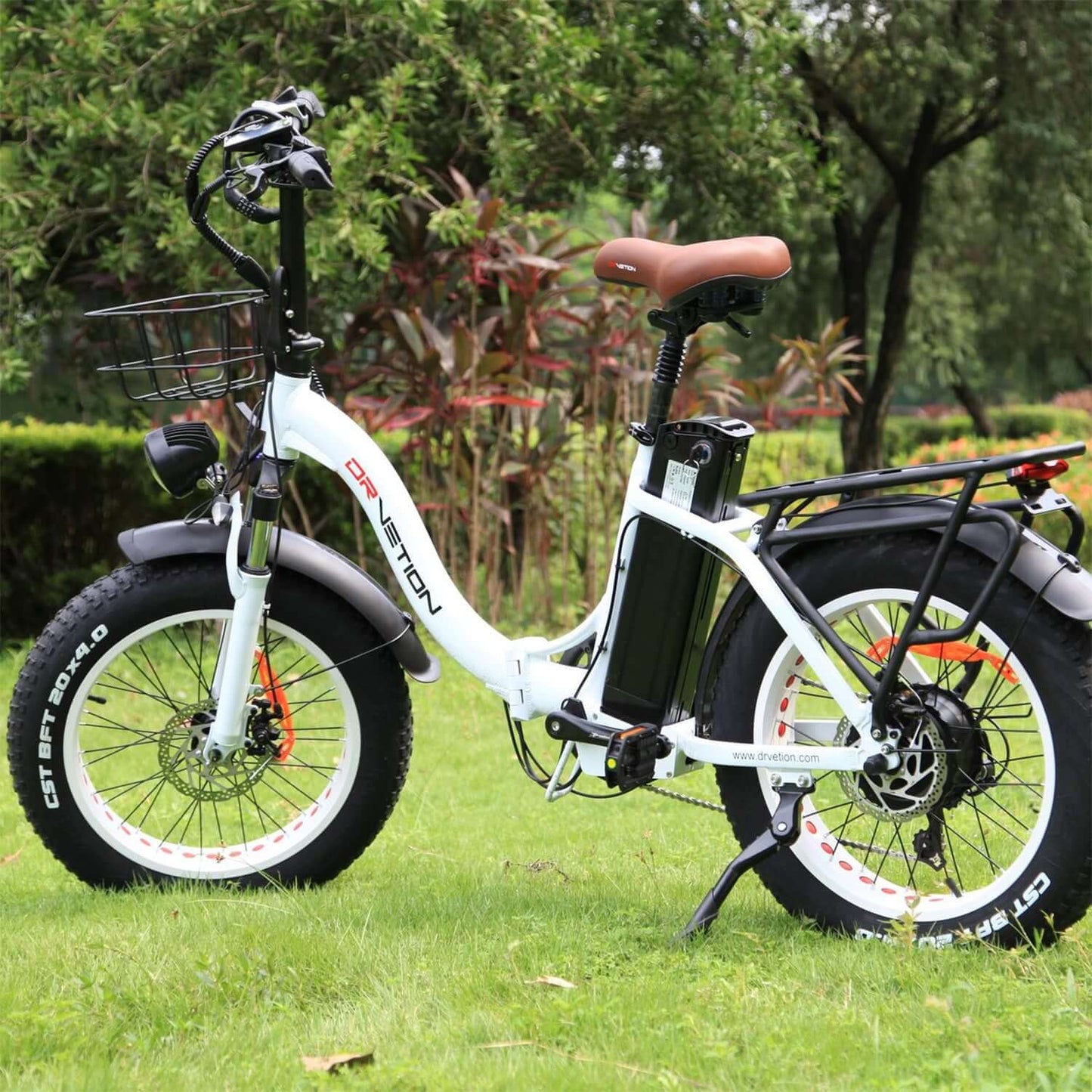 Drvetion CT20 Fat Tire Folding Electric Bike in a park setting with a black basket and wide tires.