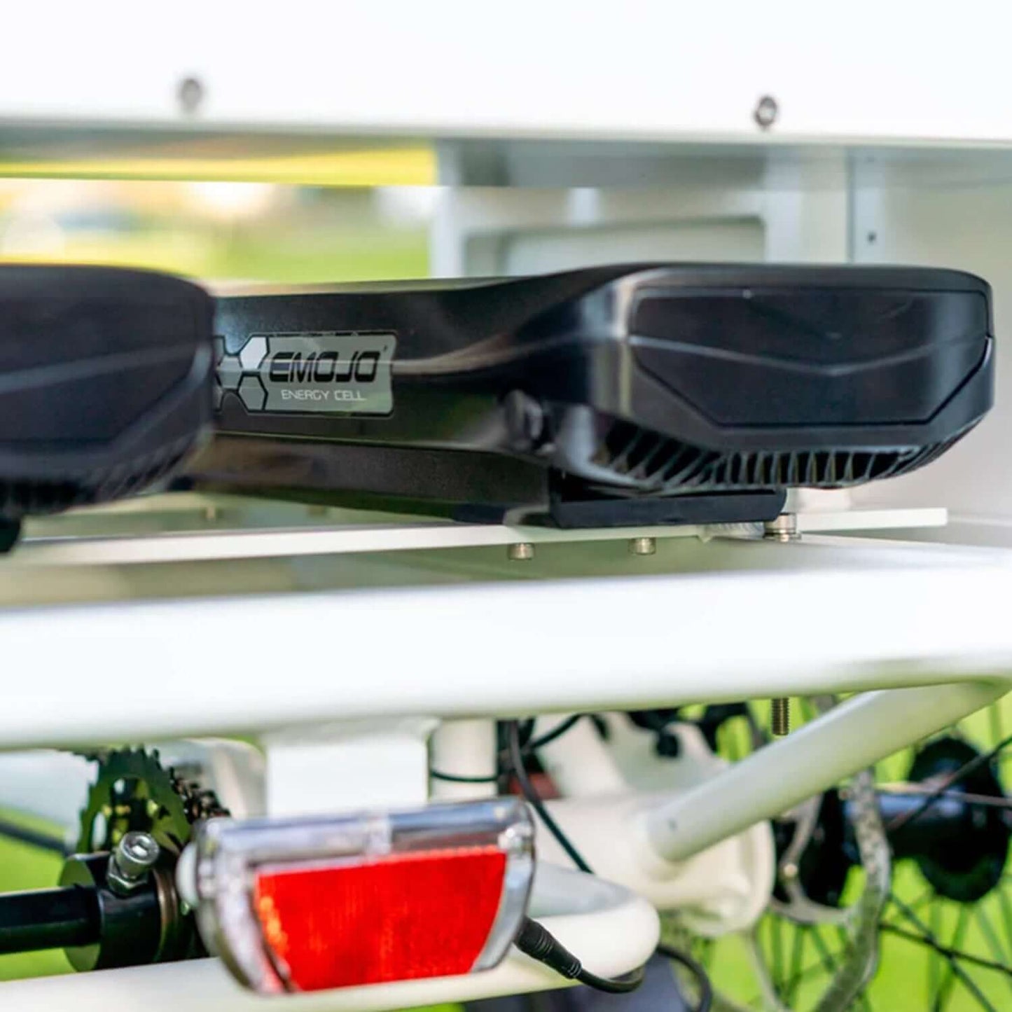Emojo energy cell mounted on an electric trike, showcasing powerful battery technology for enhanced performance.
