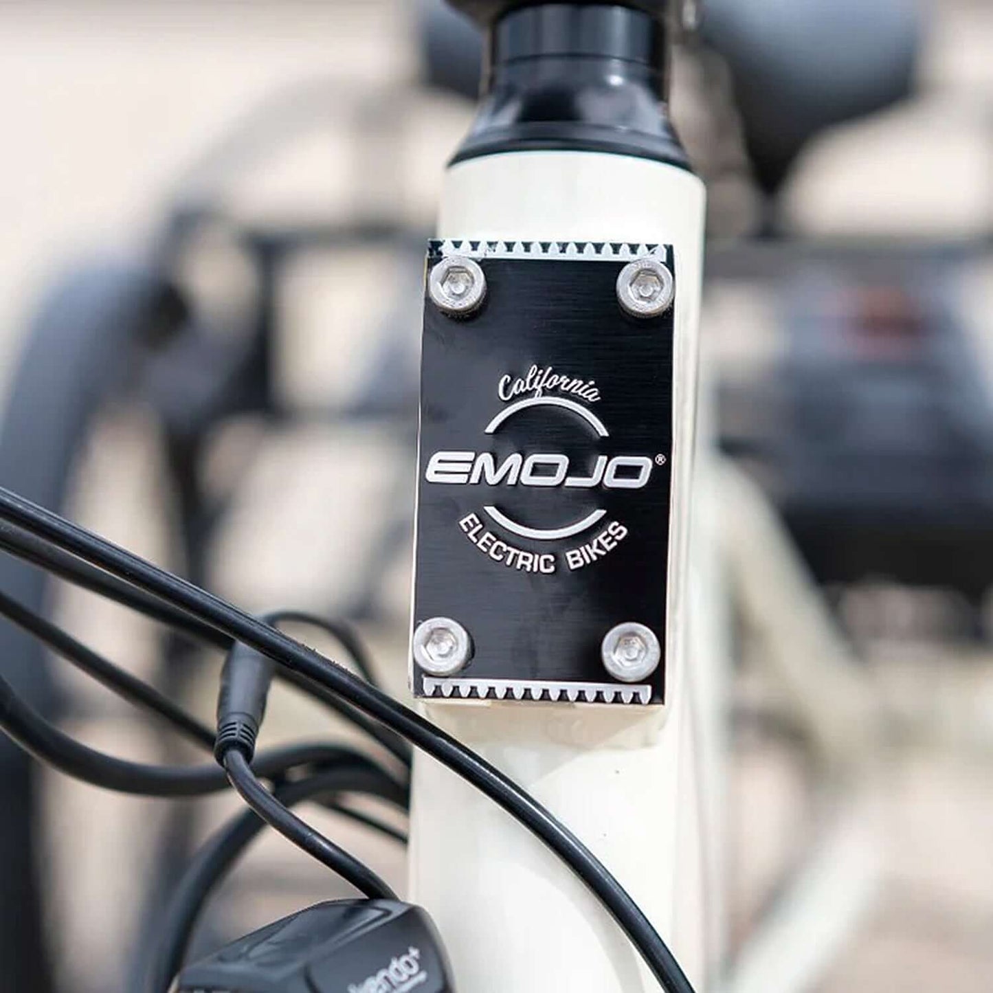 Emojo logo on the frame of the electric trike showcasing California Electric Bikes branding.