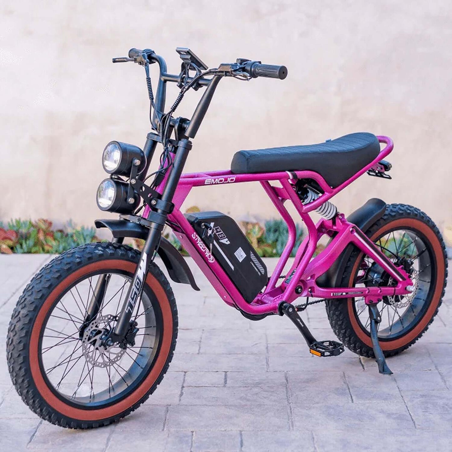 Emojo Streetrod 48V 750W fat tire electric bike in pink color, showcasing its rugged tires and modern design.