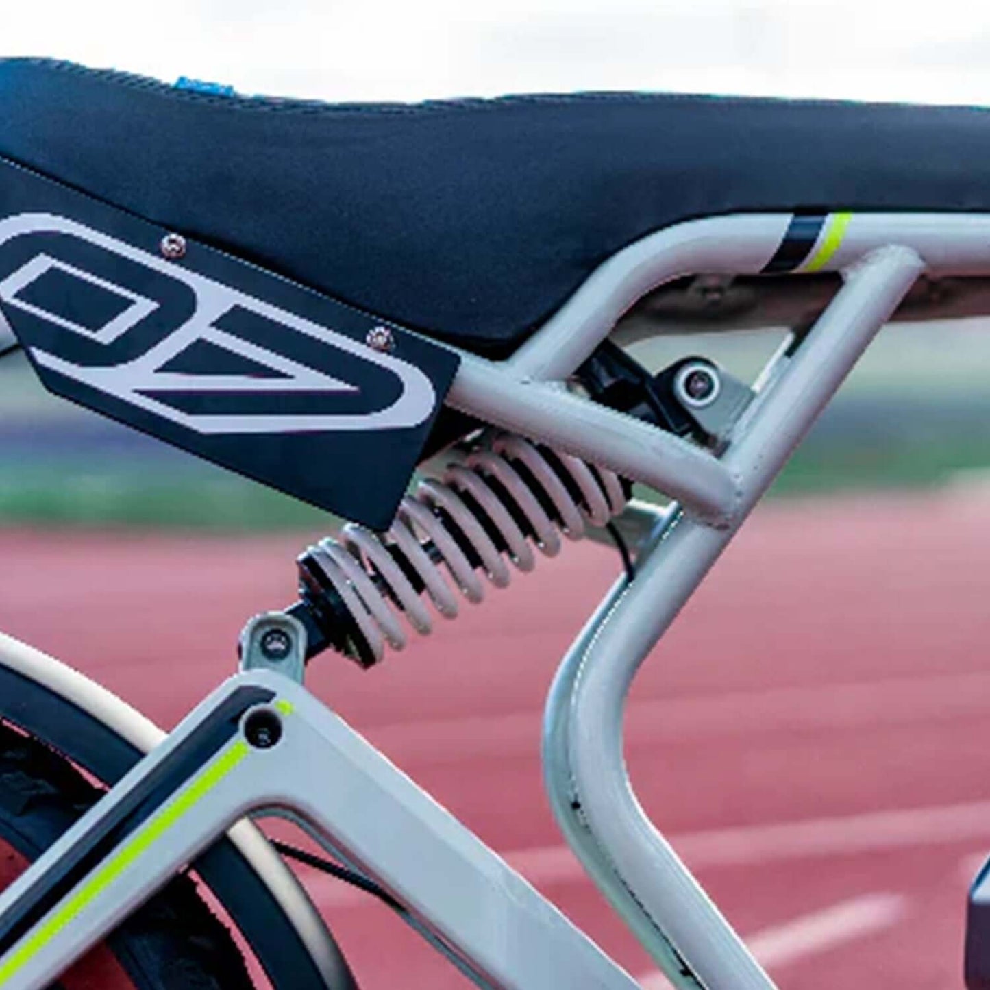 Close-up of suspension system on Emojo Streetrod electric bike's rear seat for enhanced comfort and performance.
