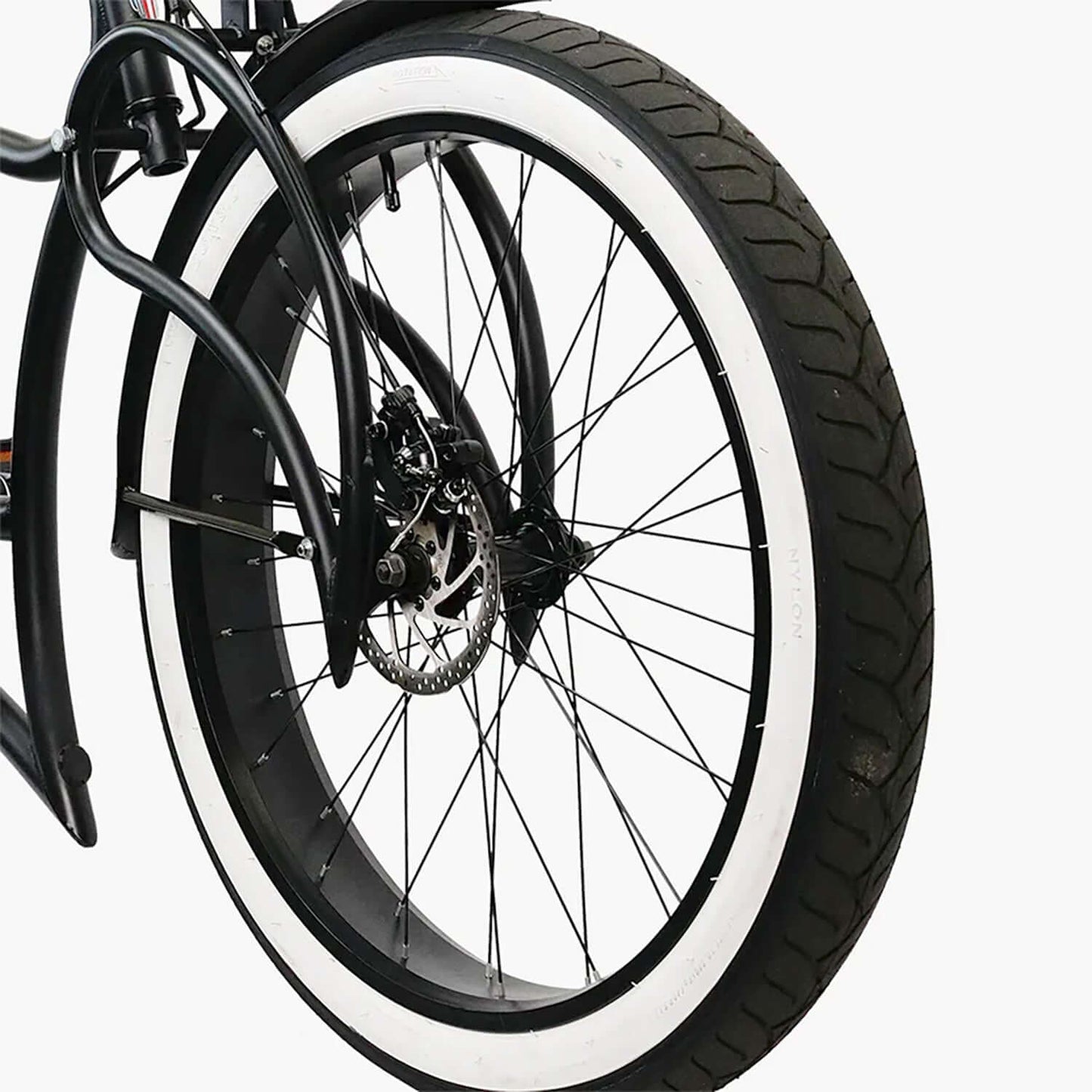 Close-up of the tire and wheel of the Tracer Beyond Pro Classic Stretch Chopper Electric Bike, showcasing its design.