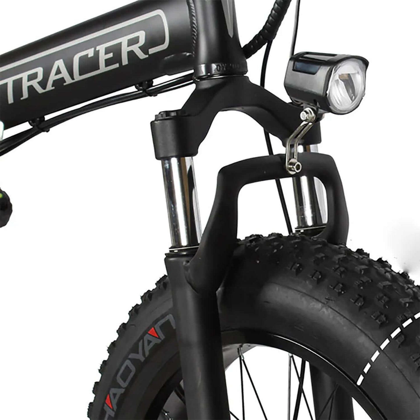 Close-up of the front fork and tire of the Tracer Coyote Foldable Electric Bike with light.