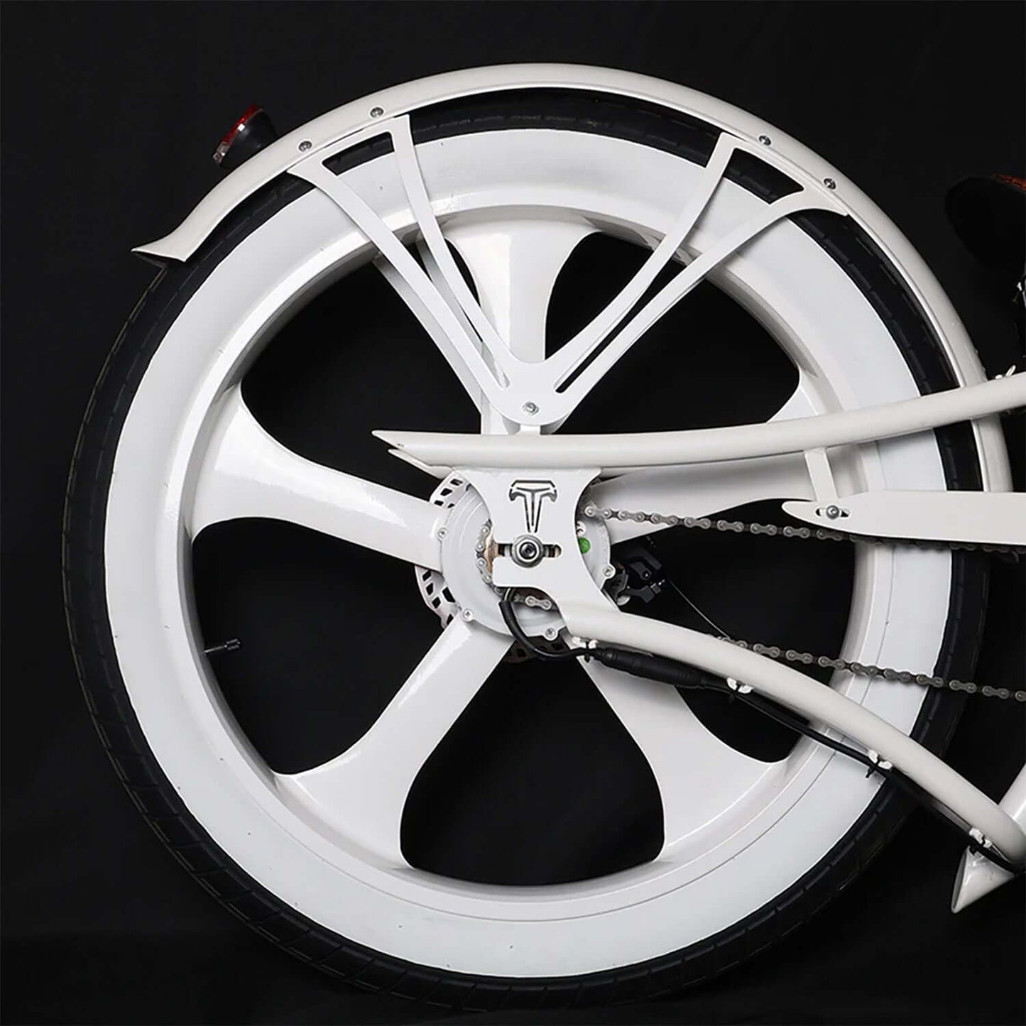 Close-up of the rear wheel of the Tracer Raptor Pro DS Stretch Cruiser Electric Bike showcasing its sleek design.