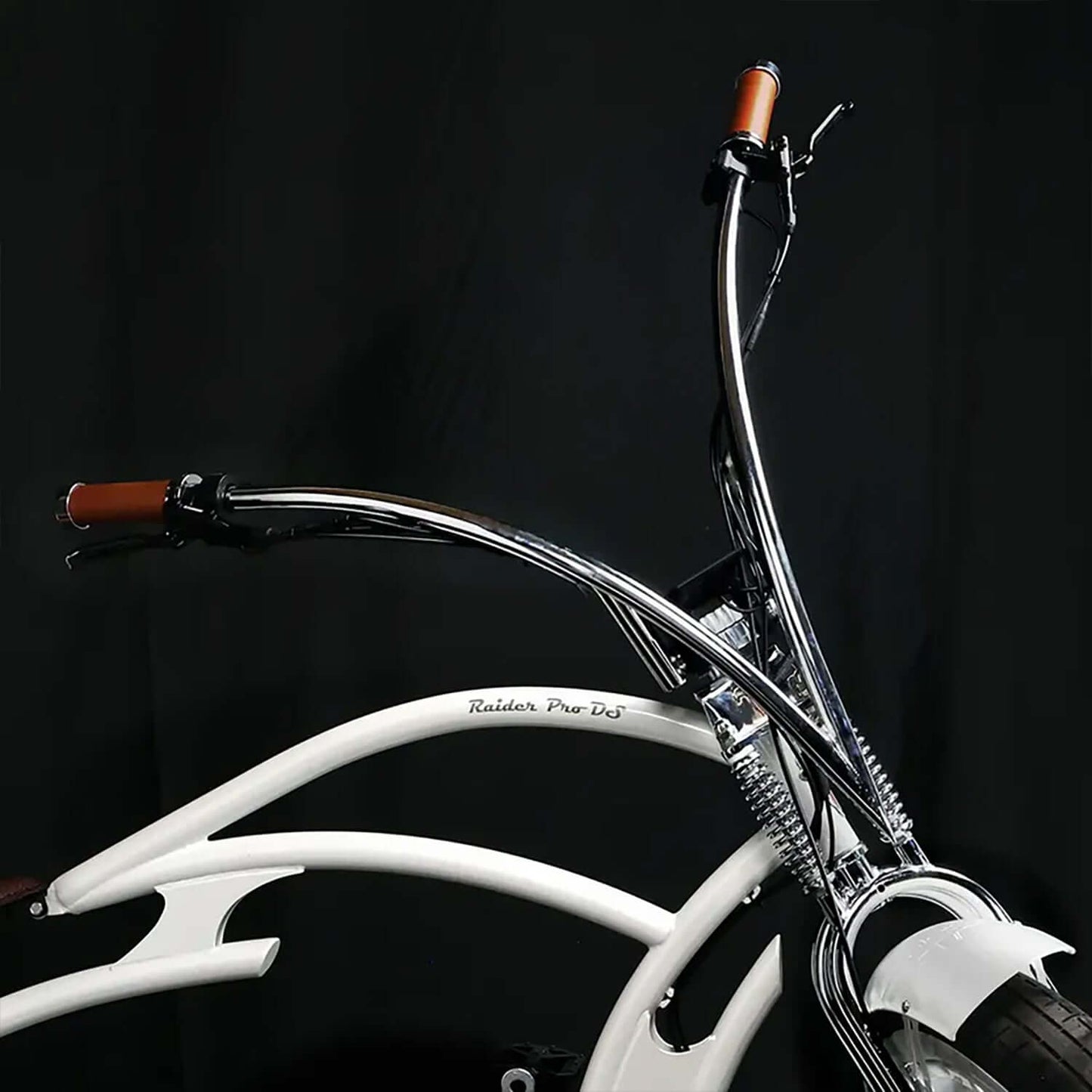 Close-up of the handlebars and frame of the Tracer Raptor Pro DS Stretch Cruiser Electric Bike, showcasing stylish chrome and brown grips.