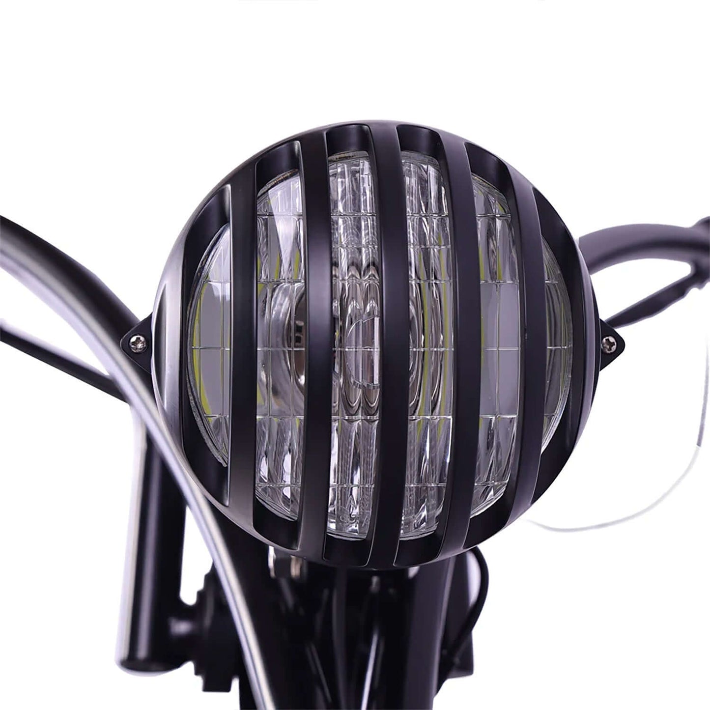 Close-up of the stylish black headlight on the Tracer Raptor Pro DS Stretch Cruiser Electric Bike.