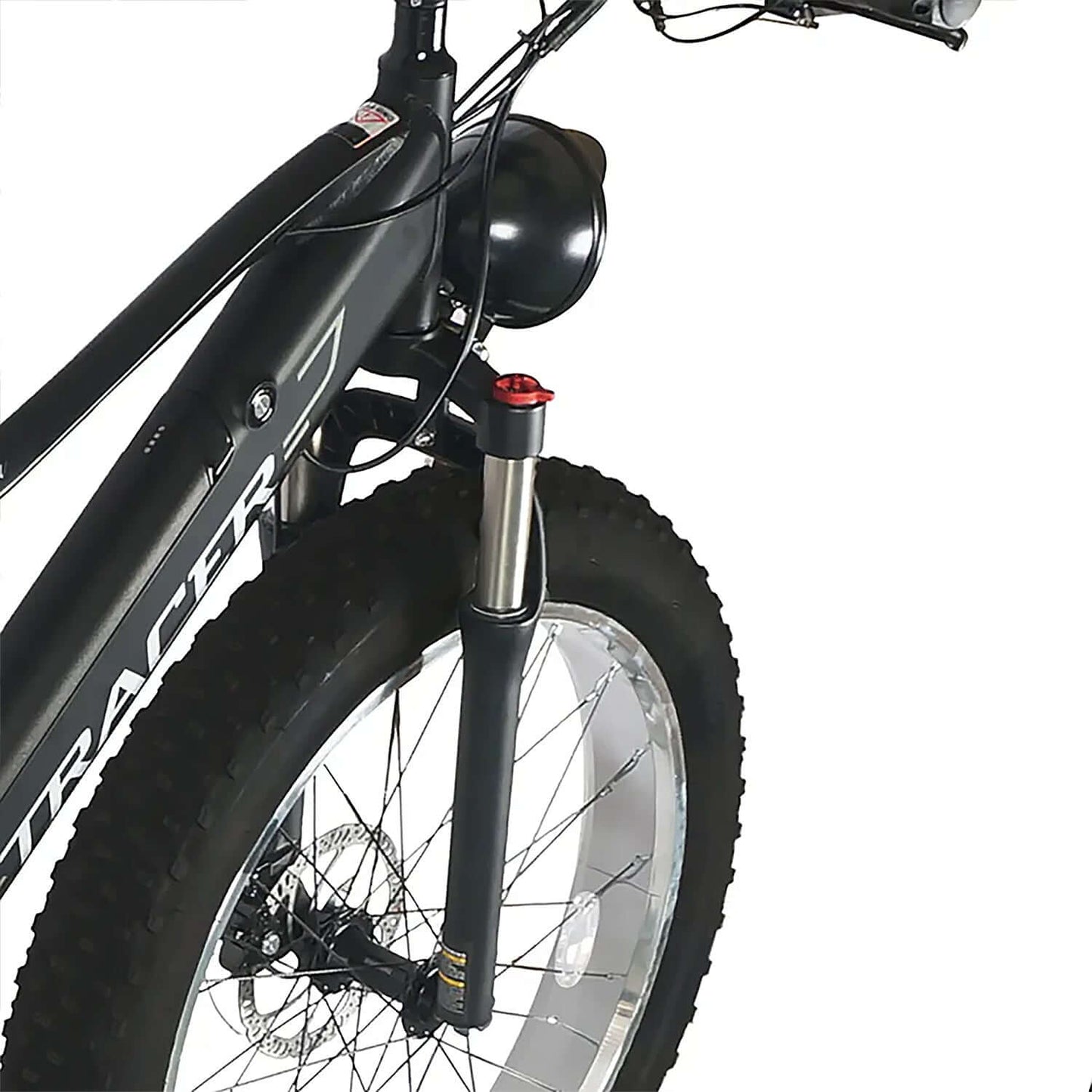 Close-up of Tracer Tacoma fat tire electric bike's front suspension with large tire and black frame.