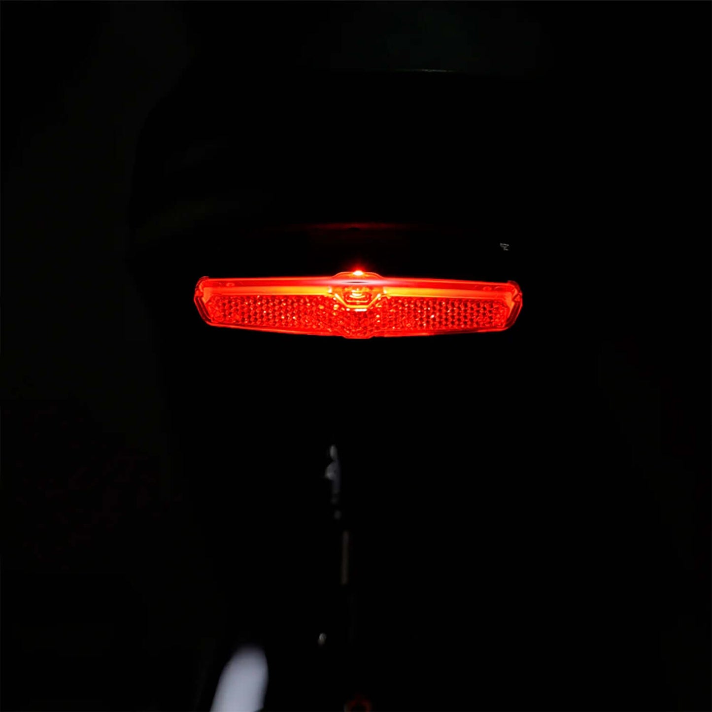 Red LED bike tail light for enhanced visibility and safety during night rides.