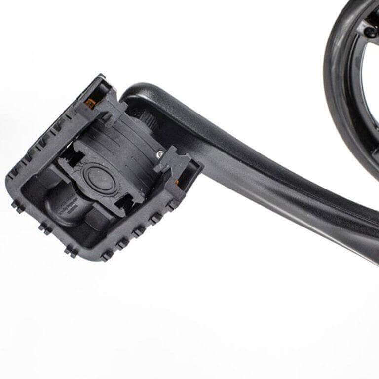 Close-up of a durable black bicycle pedal with a sturdy crank arm, designed for fat tire electric bikes.
