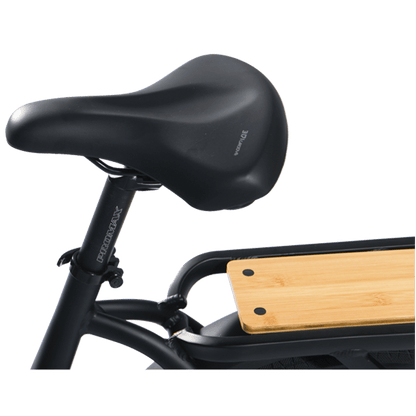 Black bicycle seat with wooden platform on a white background