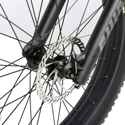 Close-up of a bicycle wheel with disc brake system on a white background
