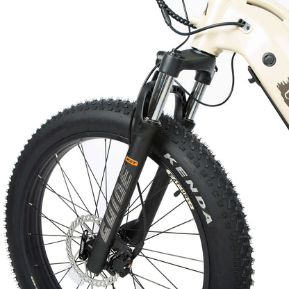 Close-up of a bicycle wheel with Kenda branding on a white background