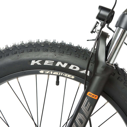 Close-up of a bicycle wheel with Kenda tire on a white background