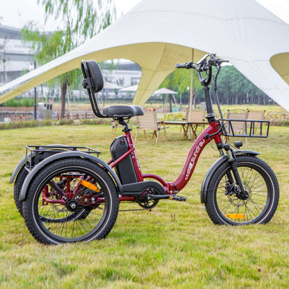 Red electric tricycle with a child seat parked under a white tent in an outdoor setting.
