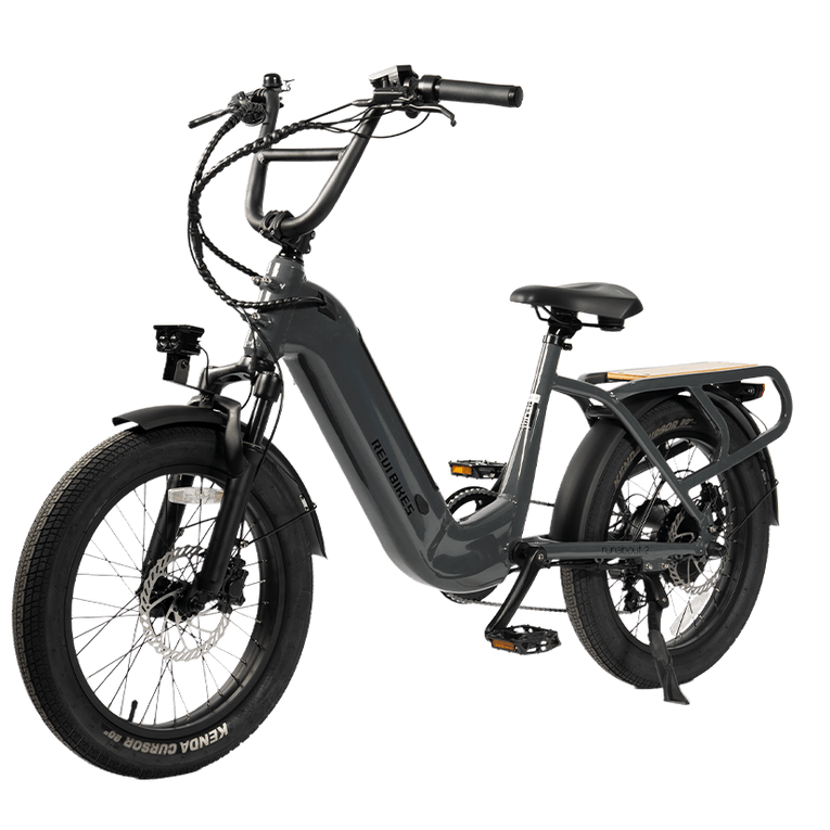 A dark gray electric bicycle with fat tires, a step-through frame, and a rear cargo rack, shown on a solid white background.