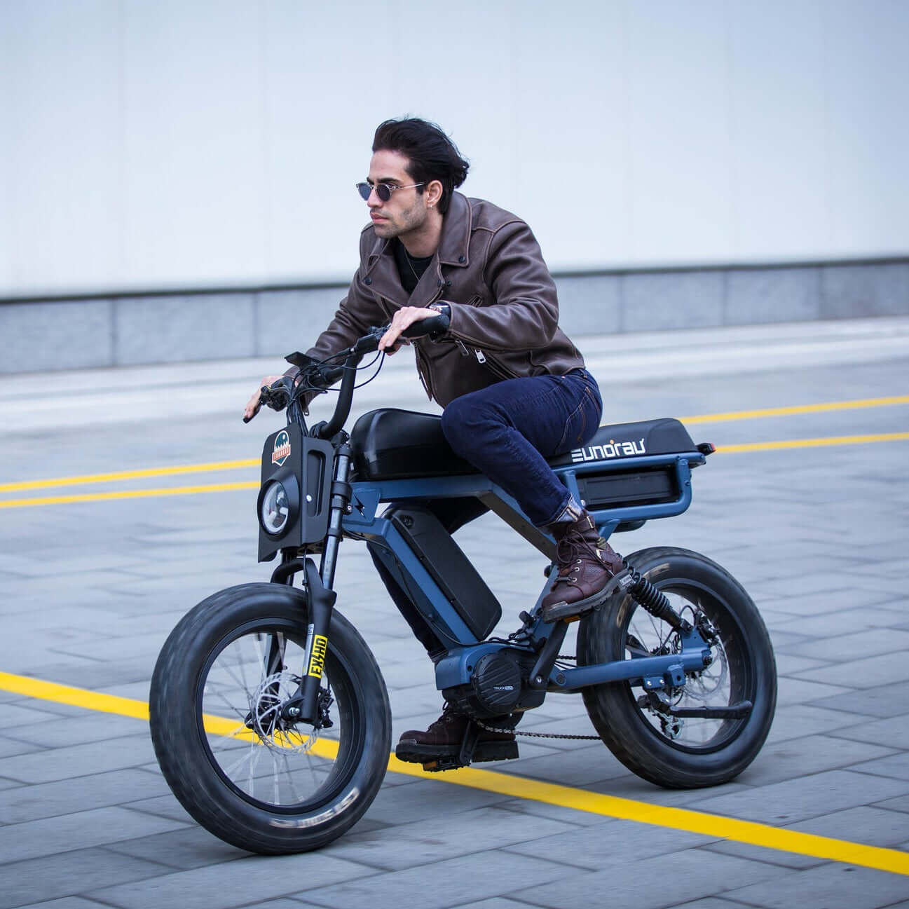 Man riding a electric bike on a city street