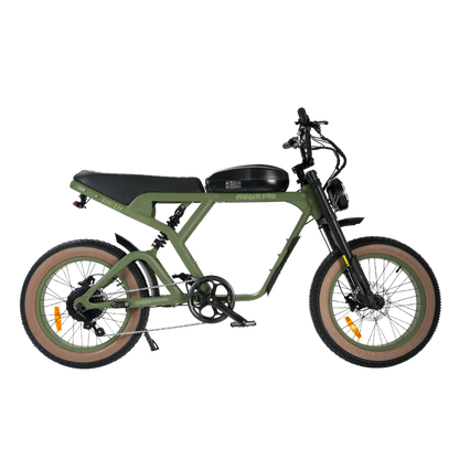 An electric bicycle with a matte olive green frame, black seat and handlebars, tan sidewall tires, and a black front suspension fork, shown on a plain white background.