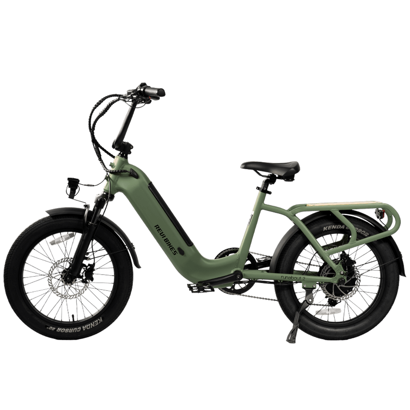 An electric bicycle in sage green with black components, shown from a side profile on a solid white background.